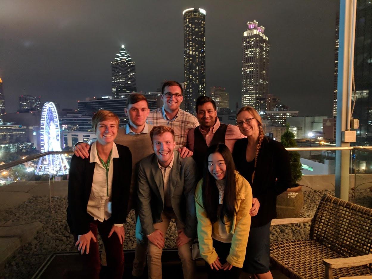 Dr. Peterson, VCU graduate students, and the Atlanta skyline.